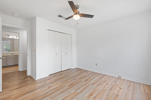 474 S Main St Unit 203, Ashland City, TN 37015 - unfurnished bedroom with ceiling fan, a closet, and light wood-type flooring