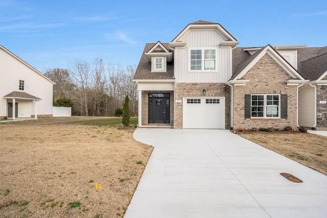 craftsman-style house with brick siding, concrete driveway, an attached garage, board and batten siding, and a front yard