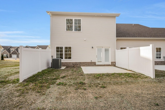 back of property with a patio area, a lawn, fence, and cooling unit