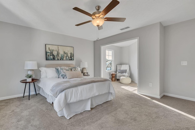 bedroom featuring baseboards, ceiling fan, visible vents, and light colored carpet