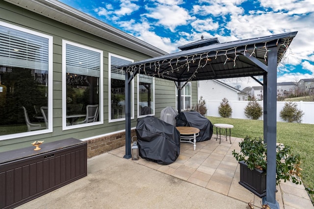 view of patio with a gazebo, a grill, and an outdoor fire pit