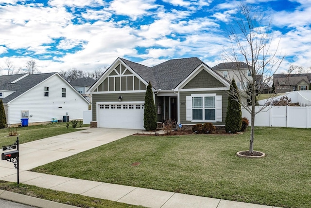 craftsman-style house featuring a garage, central air condition unit, and a front lawn