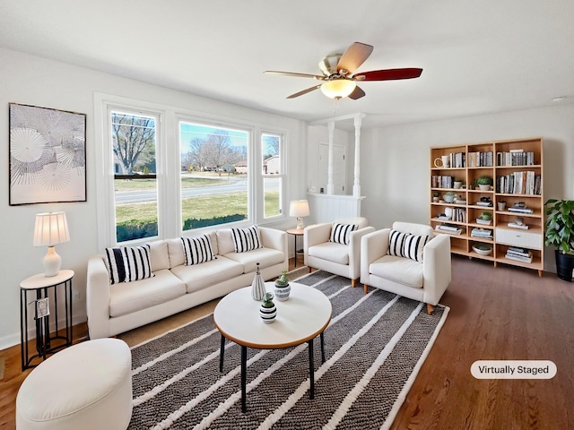 living room with ceiling fan and dark hardwood / wood-style floors