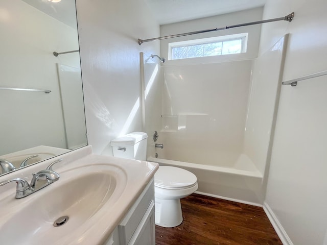 full bathroom with vanity, wood-type flooring, toilet, and shower / bathing tub combination