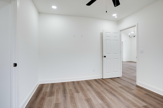 unfurnished room featuring light hardwood / wood-style flooring and ceiling fan