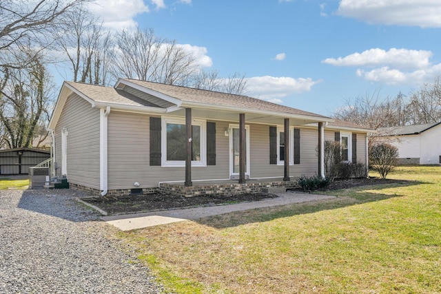 ranch-style home with a front lawn and a porch