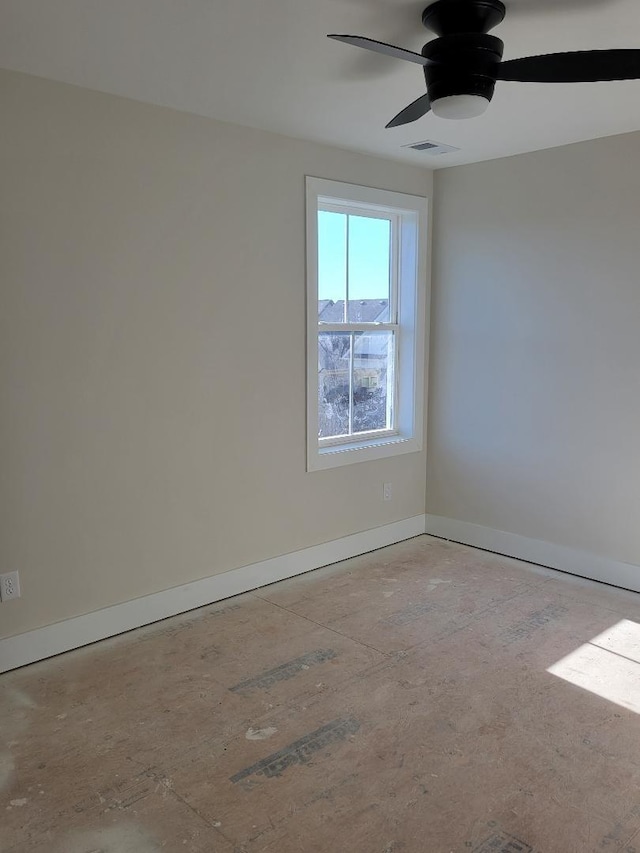 spare room with ceiling fan