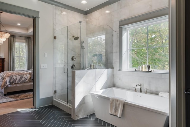 bathroom with independent shower and bath and a wealth of natural light