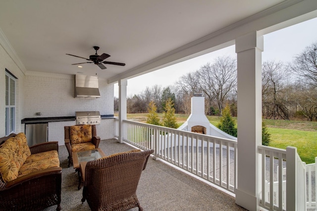 view of patio / terrace with area for grilling, a grill, a fireplace, and ceiling fan