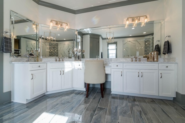 bathroom with vanity and a shower with door