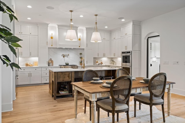 dining area with light wood-type flooring