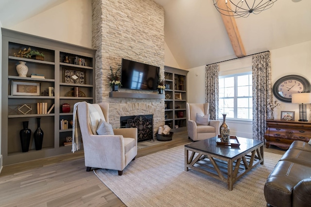 living room with wood-type flooring, a fireplace, and high vaulted ceiling