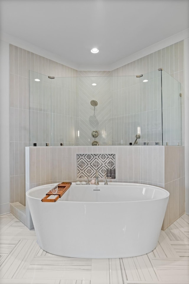 bathroom with tile walls, tile patterned flooring, and independent shower and bath