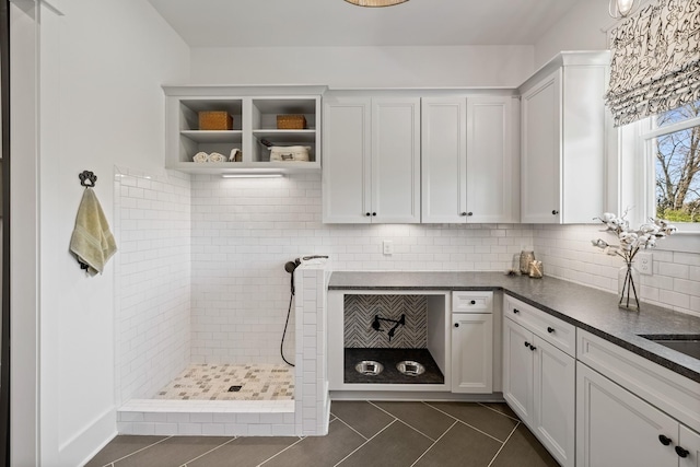 interior space with dark tile patterned flooring