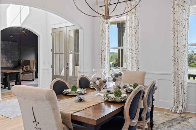 dining space with a chandelier and light wood-type flooring