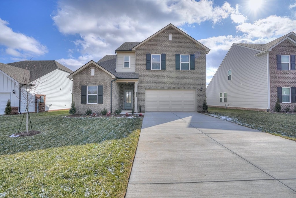 view of front of property with a garage and a front yard