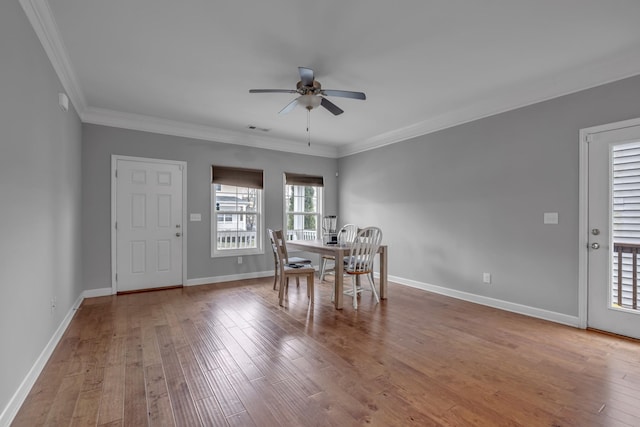 unfurnished dining area with ornamental molding, hardwood / wood-style floors, and ceiling fan