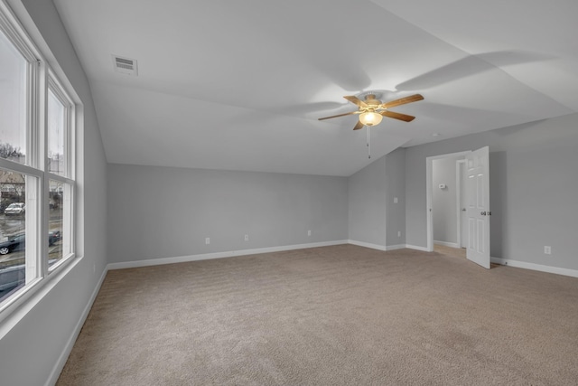 bonus room with lofted ceiling, light colored carpet, and ceiling fan