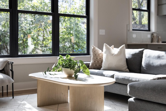 interior space with baseboards and wood finished floors