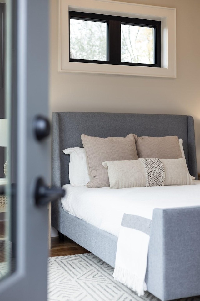 bedroom with wood finished floors