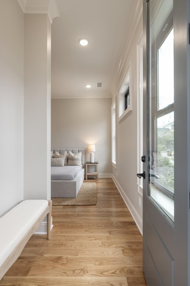 interior space featuring crown molding, recessed lighting, visible vents, light wood-style floors, and baseboards