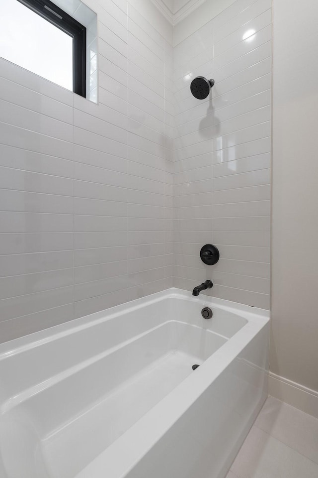 full bath featuring washtub / shower combination and baseboards