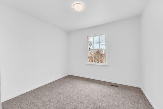 unfurnished room with carpet floors