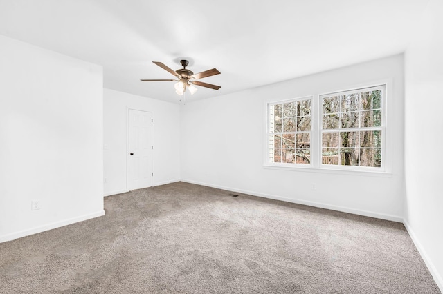 carpeted empty room with ceiling fan