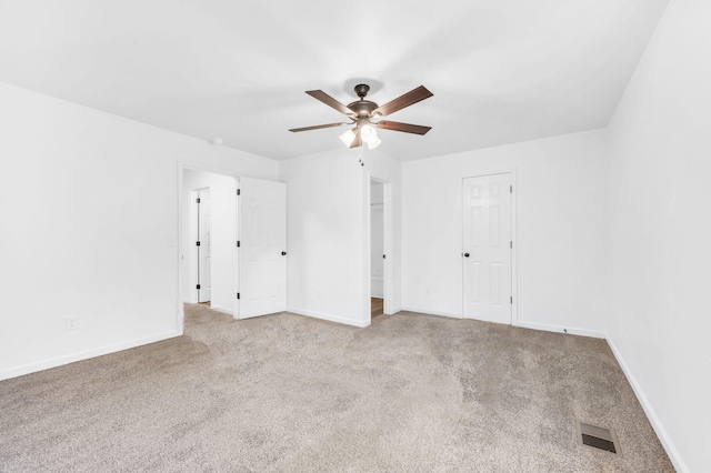 unfurnished bedroom featuring ceiling fan and light carpet