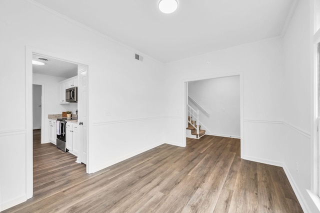 unfurnished room with hardwood / wood-style flooring