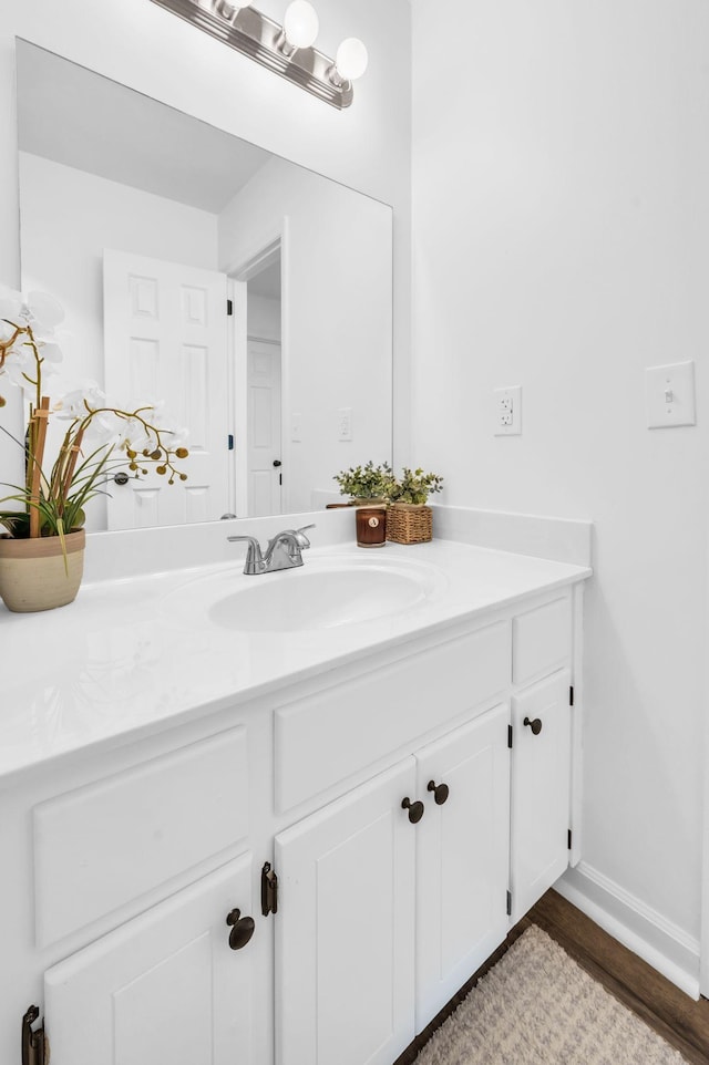 bathroom featuring vanity and hardwood / wood-style floors