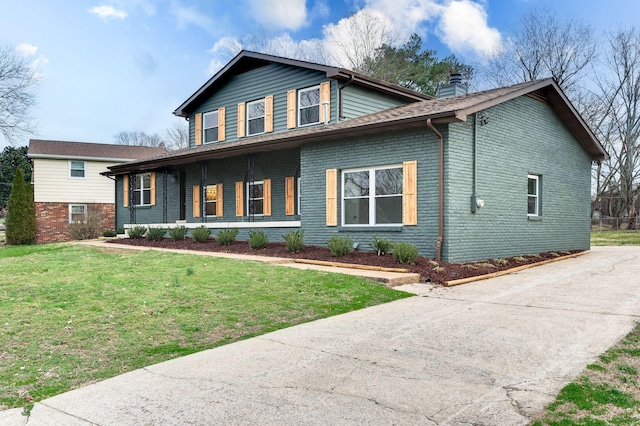 view of front of home with a porch and a front yard