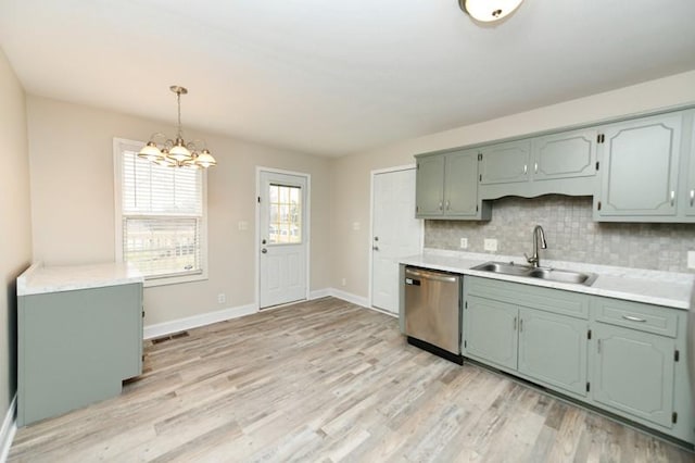 1765 Copperfield Ct, Clarksville, TN 37042 - kitchen featuring a sink, light wood-type flooring, stainless steel dishwasher, and decorative backsplash