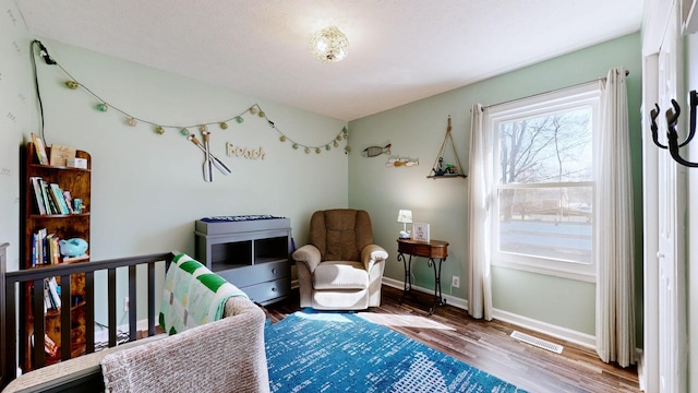 bedroom with hardwood / wood-style floors