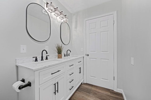 bathroom with vanity and hardwood / wood-style floors