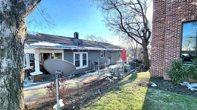 rear view of house featuring a patio area and fence