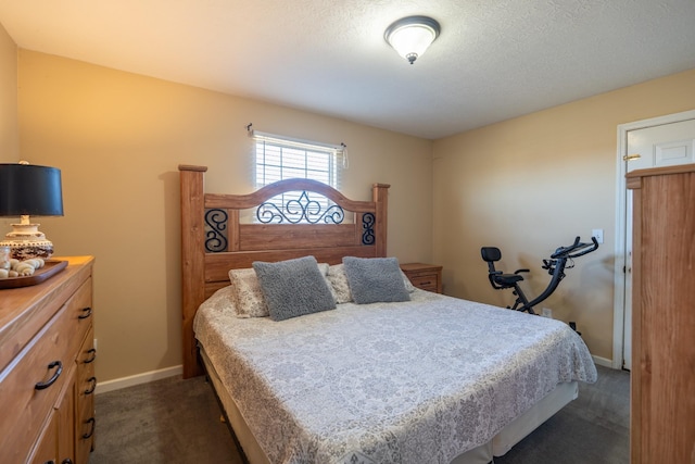 carpeted bedroom with a textured ceiling