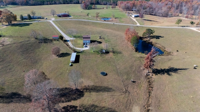 aerial view with a rural view and a water view