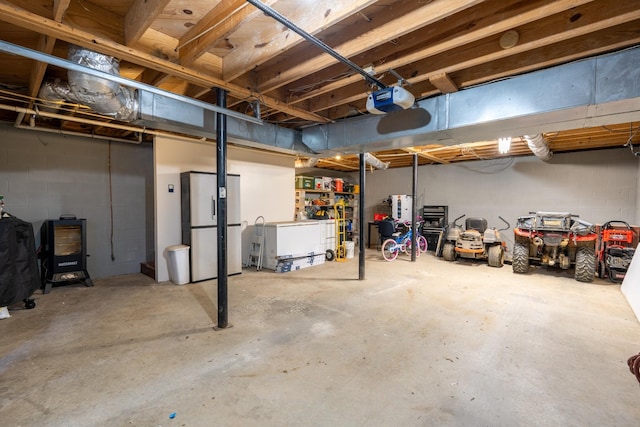 basement with stainless steel refrigerator