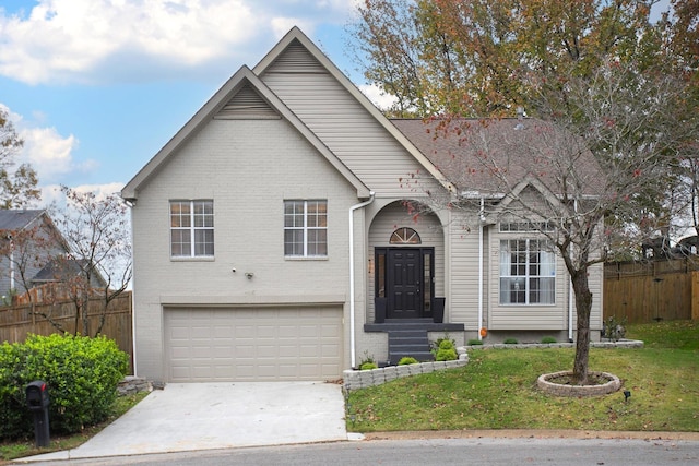 view of front of house featuring a garage and a front yard