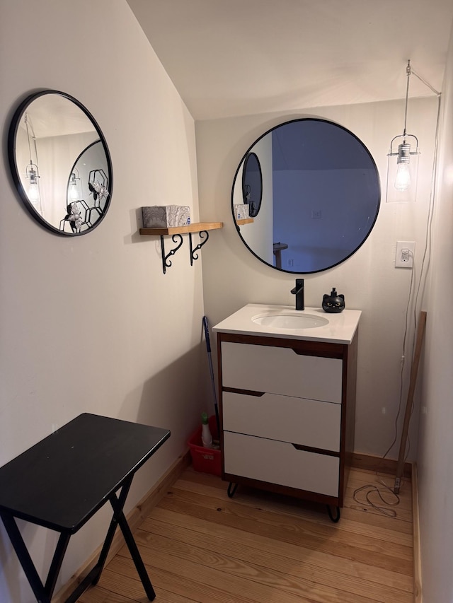 bathroom featuring vanity and wood-type flooring