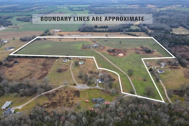 birds eye view of property featuring a rural view