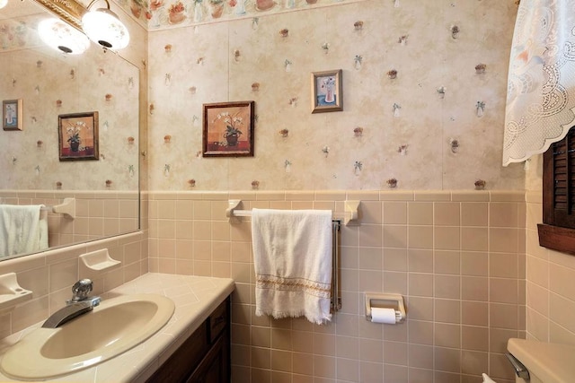 1144 Miller Rd, Lewisburg, TN 37091 - bathroom featuring wallpapered walls, tile walls, toilet, vanity, and wainscoting