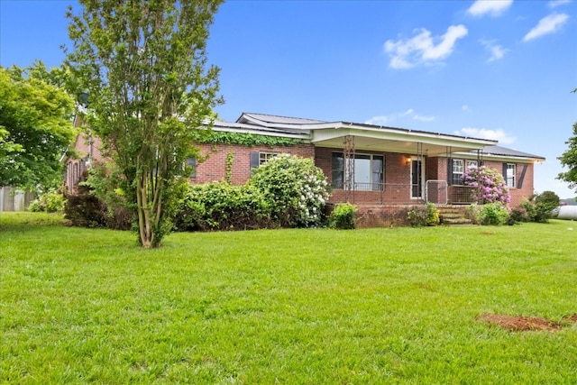 1144 Miller Rd, Lewisburg, TN 37091 - view of front facade featuring brick siding, a front yard, and a porch