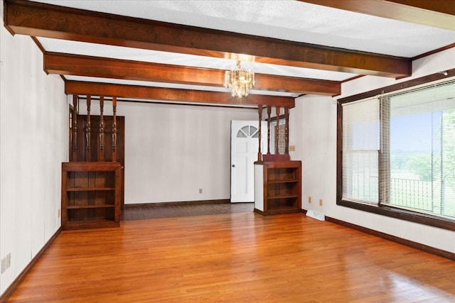 1144 Miller Rd, Lewisburg, TN 37091 - unfurnished living room featuring wood finished floors, a chandelier, beamed ceiling, and baseboards