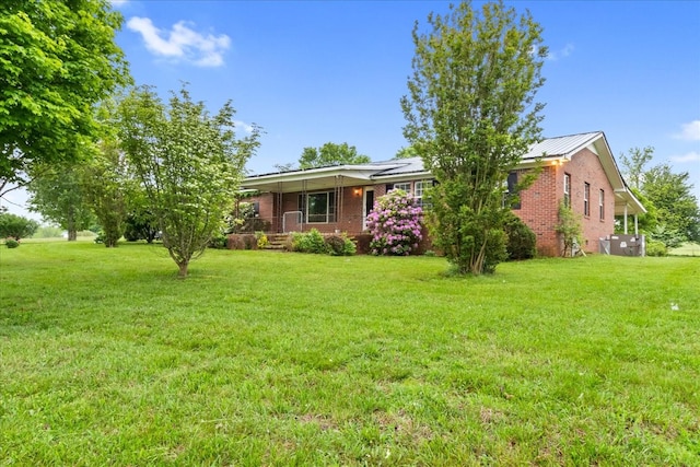 1144 Miller Rd, Lewisburg, TN 37091 - ranch-style house featuring brick siding, a porch, and a front lawn
