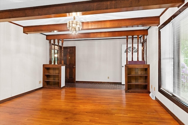 1144 Miller Rd, Lewisburg, TN 37091 - empty room featuring wood finished floors, a chandelier, beamed ceiling, and baseboards
