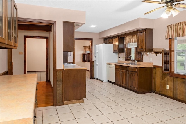 1144 Miller Rd, Lewisburg, TN 37091 - kitchen with white appliances, a sink, light countertops, a ceiling fan, and a wainscoted wall