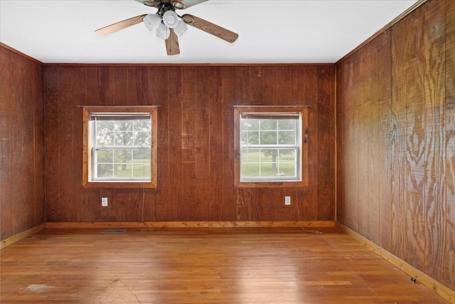 1144 Miller Rd, Lewisburg, TN 37091 - empty room with wood-type flooring, baseboards, wooden walls, and ceiling fan