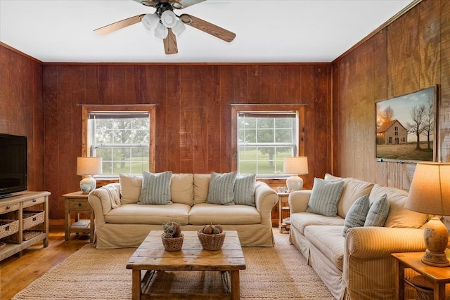 1144 Miller Rd, Lewisburg, TN 37091 - living room featuring a ceiling fan, wood walls, and light wood finished floors